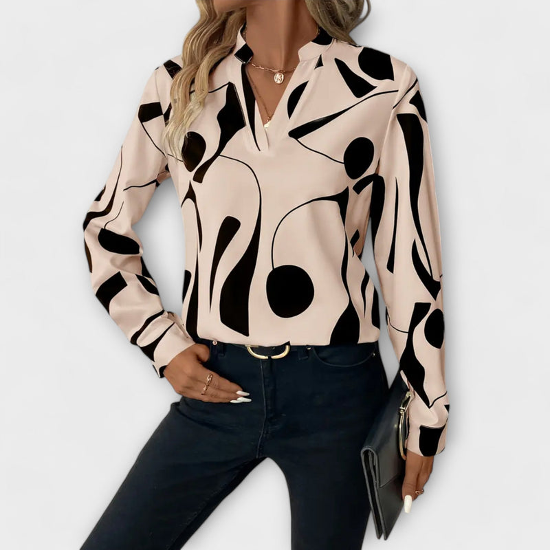 Elegant long-sleeved blouse with V-neck and geometric pattern
