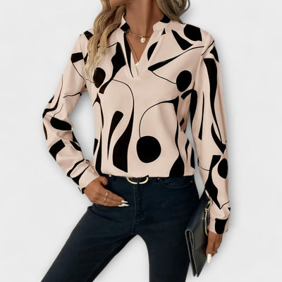 Elegant long-sleeved blouse with V-neck and geometric pattern