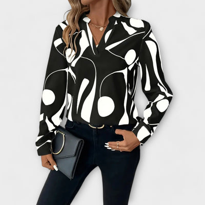 Elegant long-sleeved blouse with V-neck and geometric pattern