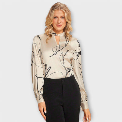 Elegant blouse with line pattern and keyhole detail