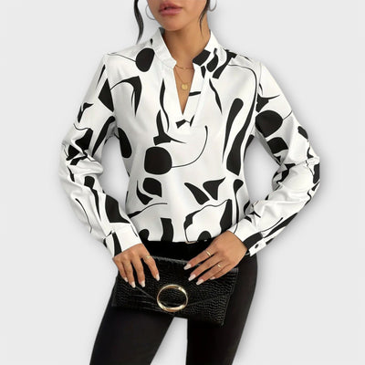 Elegant long-sleeved blouse with V-neck and geometric pattern